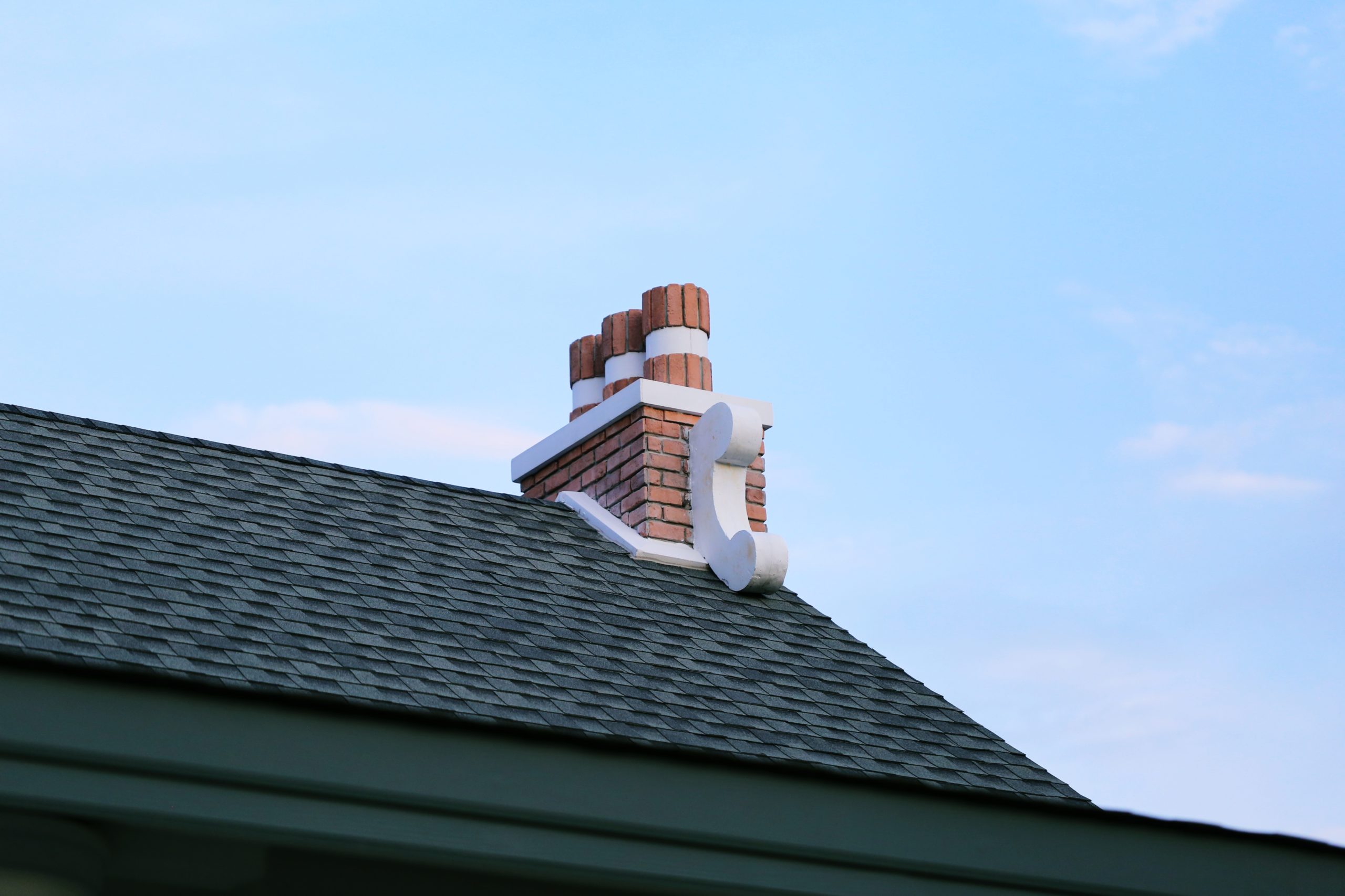 Red brick chimney on roof