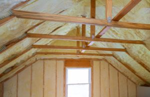 Attic with insulation and wooden beams